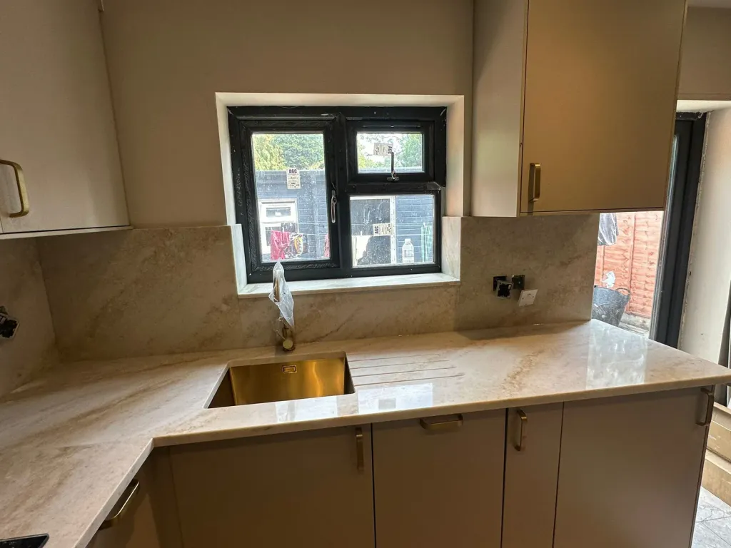 Gold-veined quartz worktop and upstand fitted by Marvra in a London kitchen