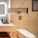 Ascoli Beige 40 × 90 cm Matt porcelain tile, bathroom with a bath and lit niche