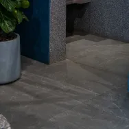 Harrat Anthracite 120 × 60 cm Matt porcelain tile, reception floor with a planter