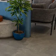 Harrat Anthracite 120 × 60 cm Matt porcelain tile, lounge floor with a planter