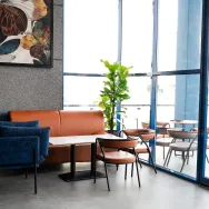 Harrat Anthracite 120 × 60 cm Matt porcelain tile, café booth by the window