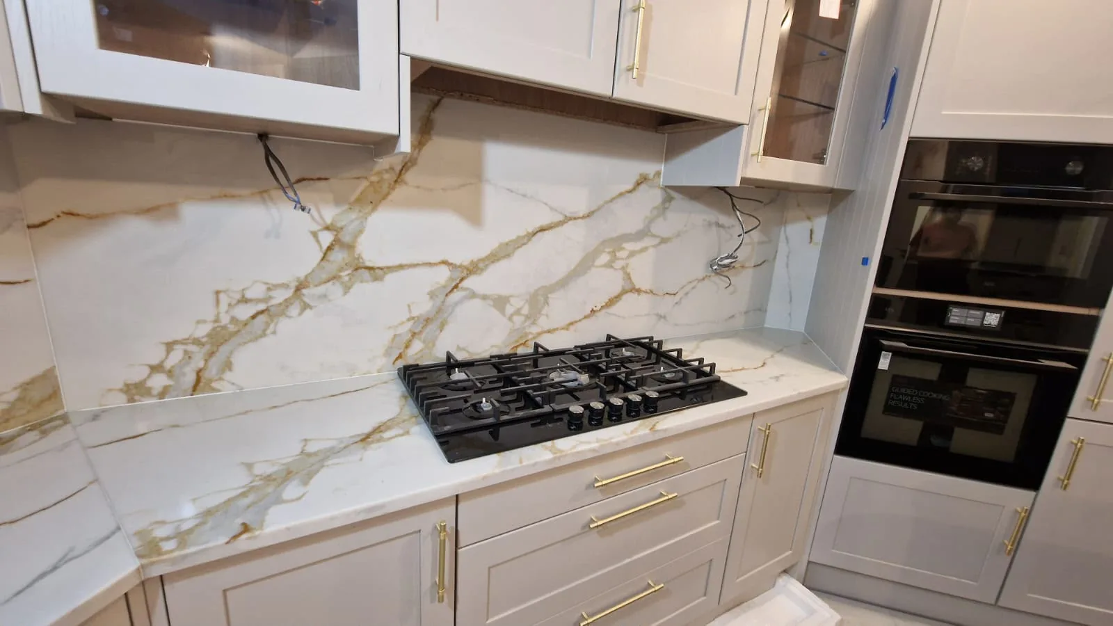 Bold gold veining worktop fitted by Marvra