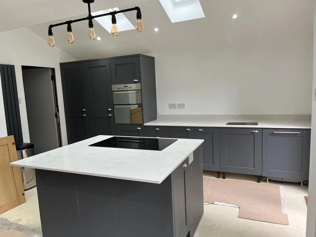 Marvra worktop installation: white with grey veining, island, graphite units